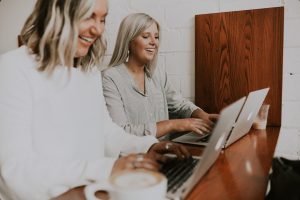 2022 Quality of Advice Review September Paraplanners smiling at laptops