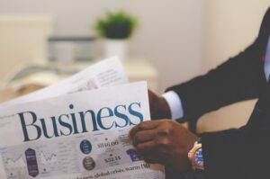 Business newspaper being read by a financial planner 